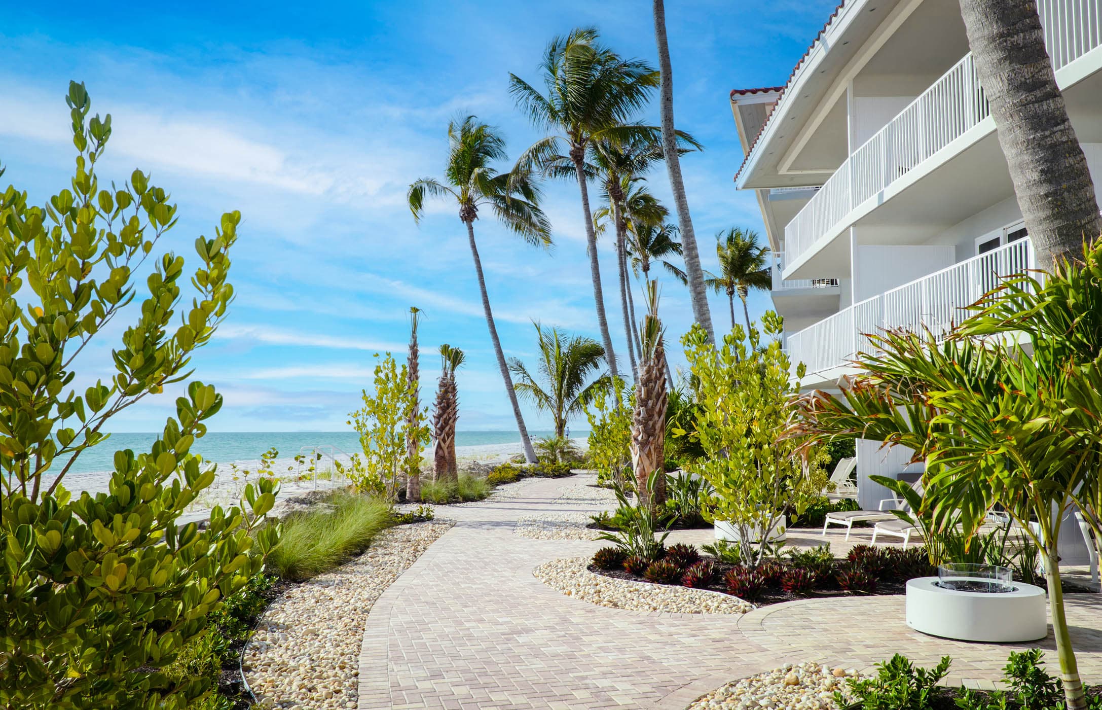 A path outside some balconies of the hotel along the beach