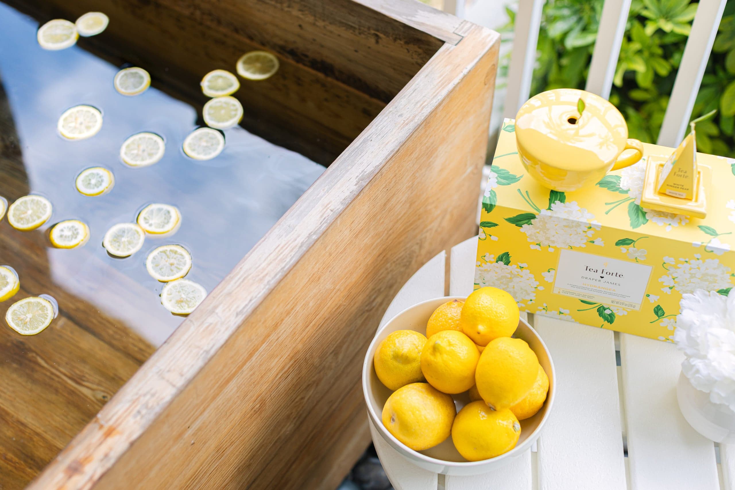 A display of lemon water with lemons and lemon tea