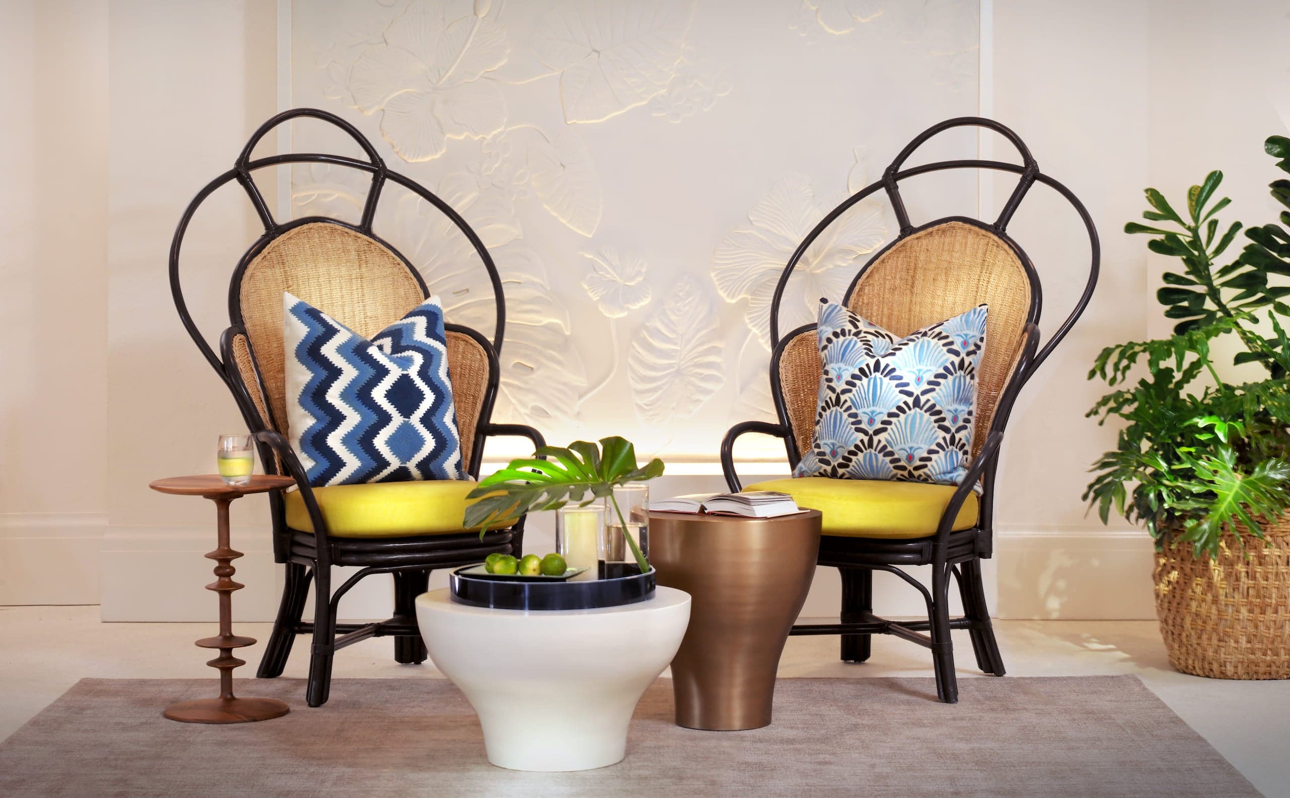 2 chairs with 2 small tables with beverages and snacks