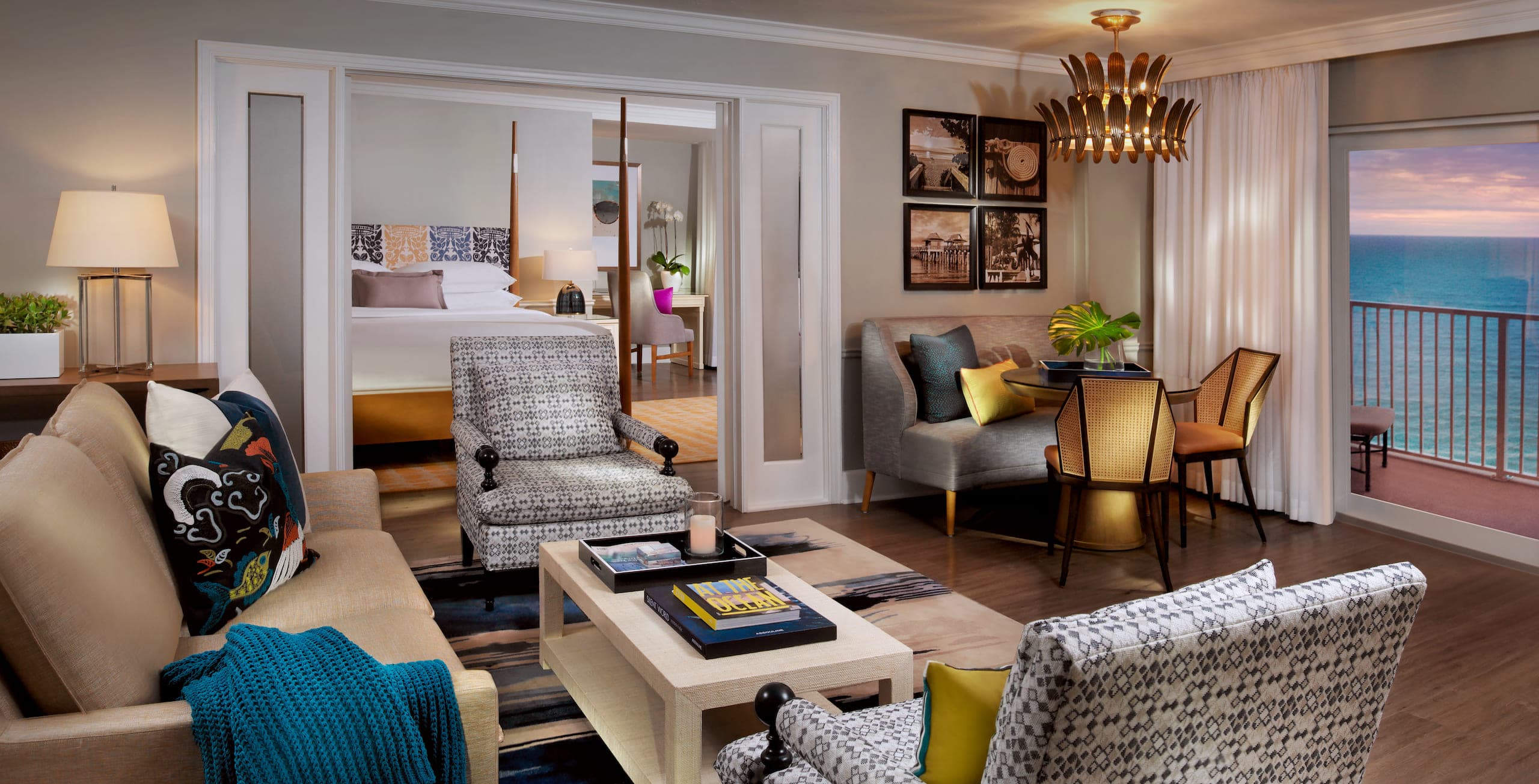 The living space with plenty of seating with a view of the water in a Gulf Tower suite at LaPlaya