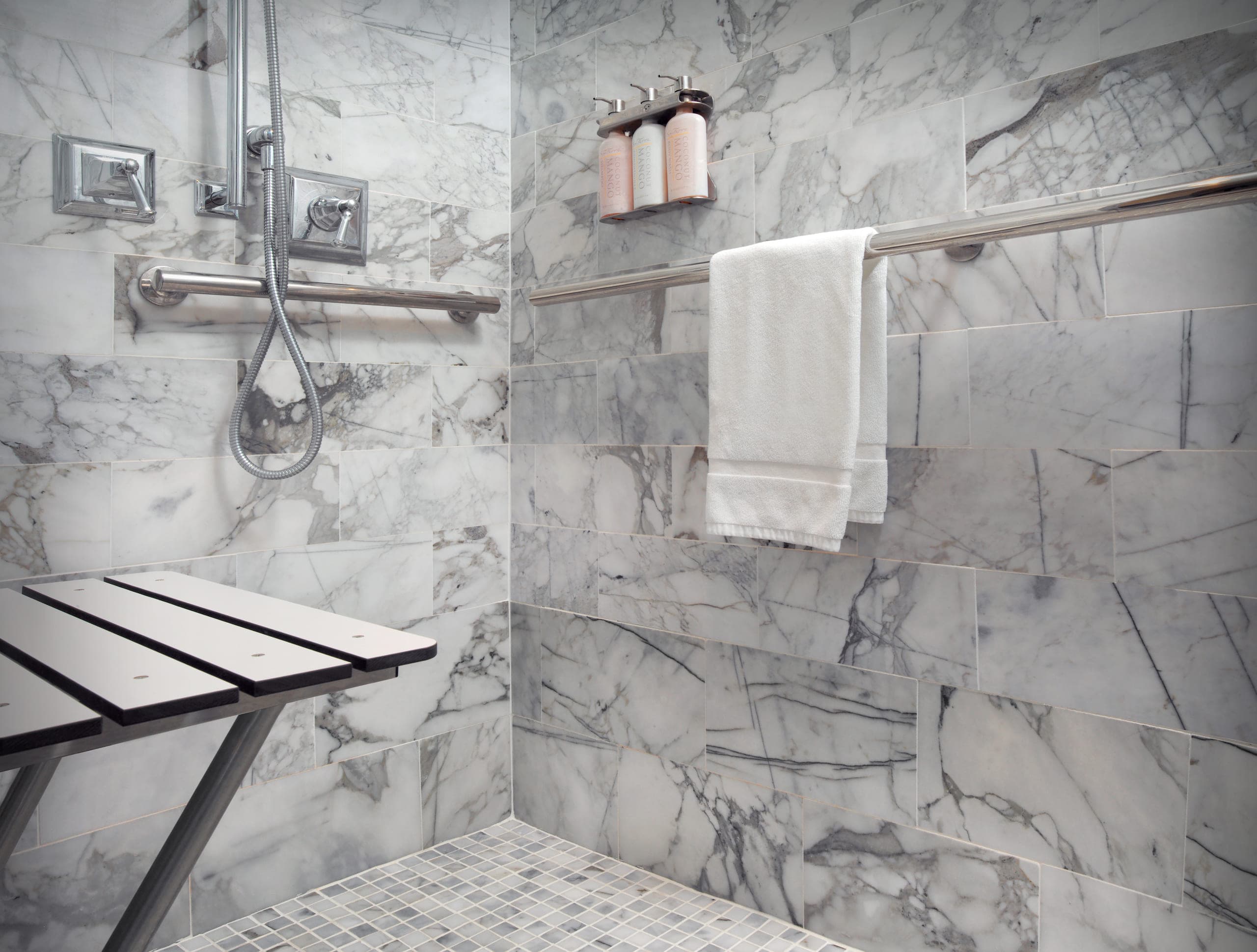 ADA shower with grab bars and a seat at LaPlaya