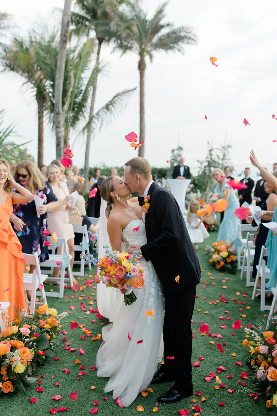 A couple just married, kissing on the lawn at LaPlaya