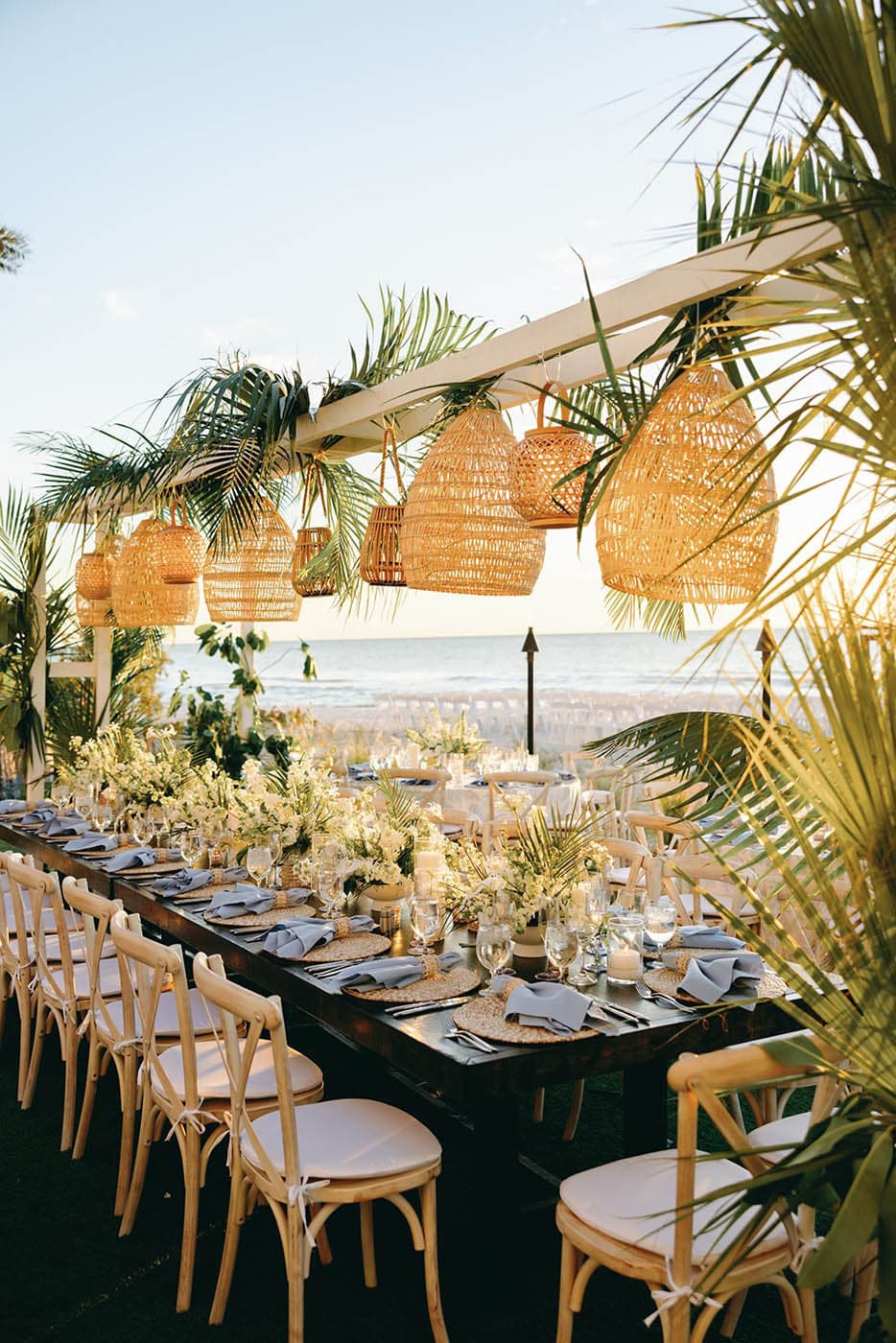 A long table setup for a celebration on the beach of LaPlaya
