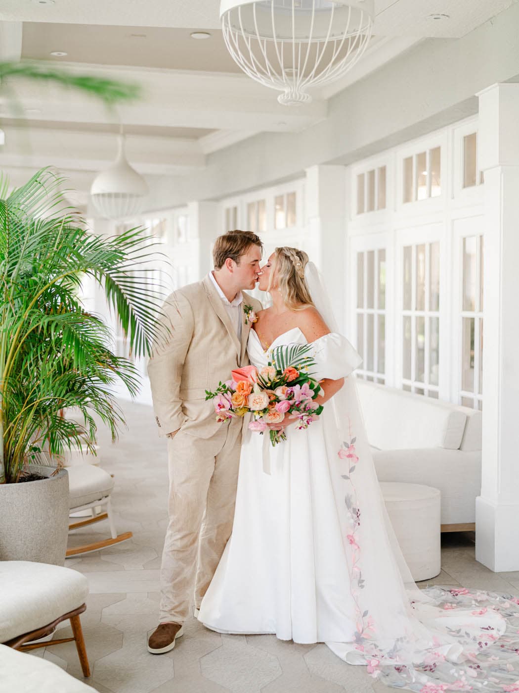 Madison + Chad kissing at LaPlaya during their wedding