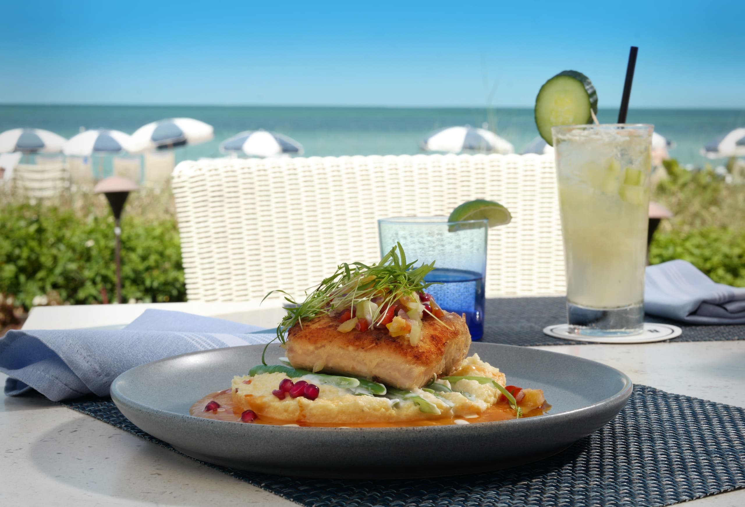 A fish dish with polenta and a cucumber cocktail
