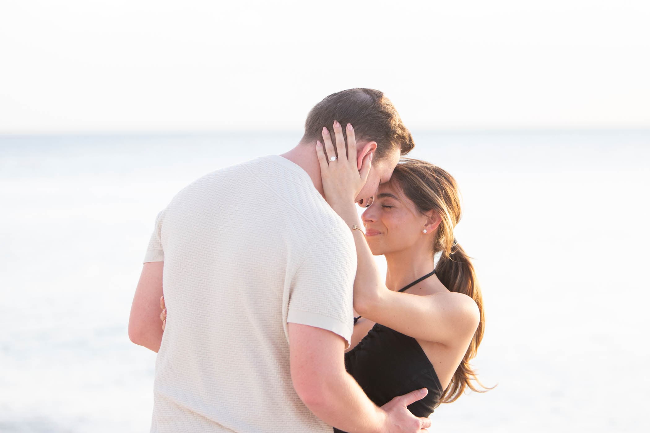 A couple embracing on the beach at LaPlaya