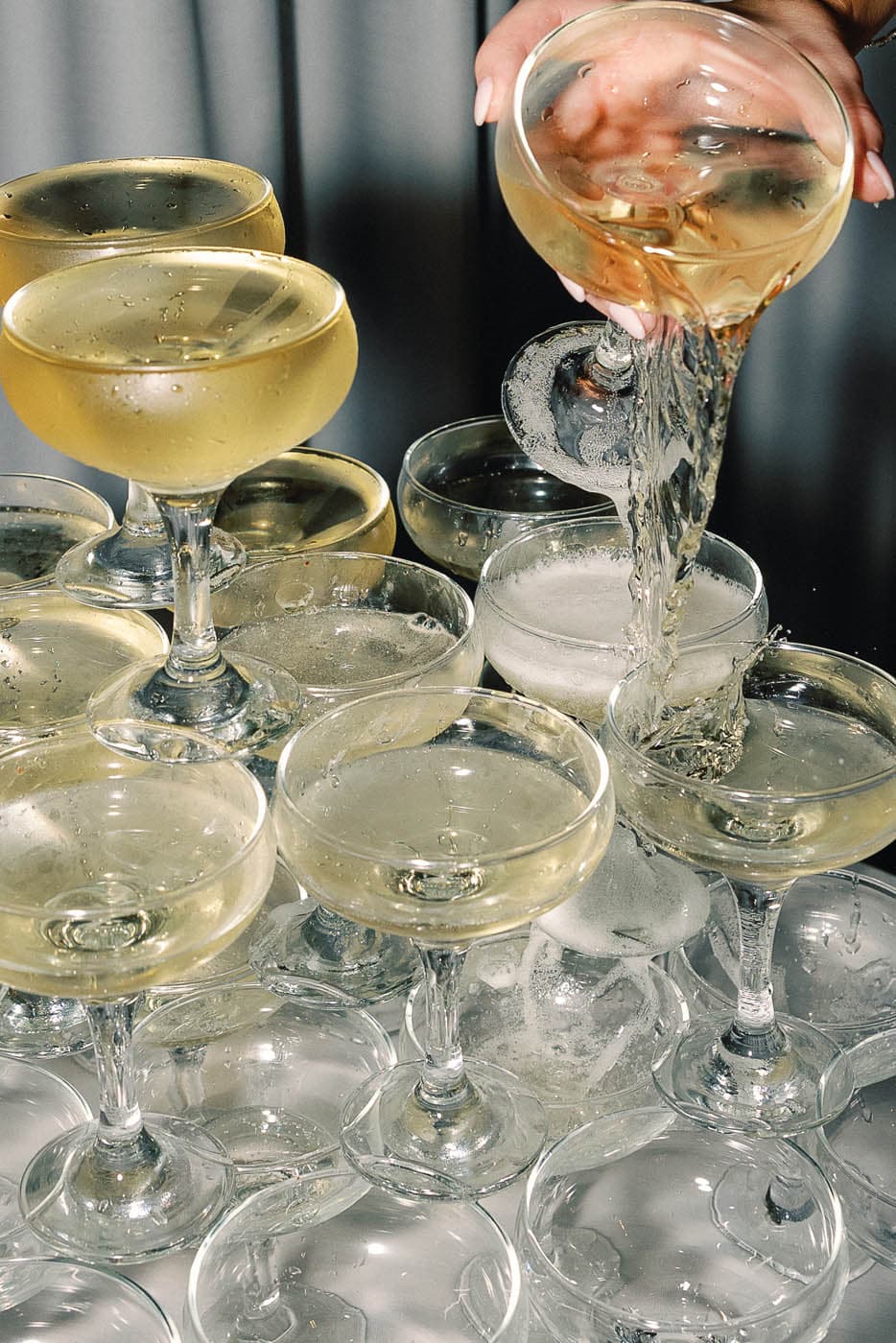 A stack of wine in glasses on a table