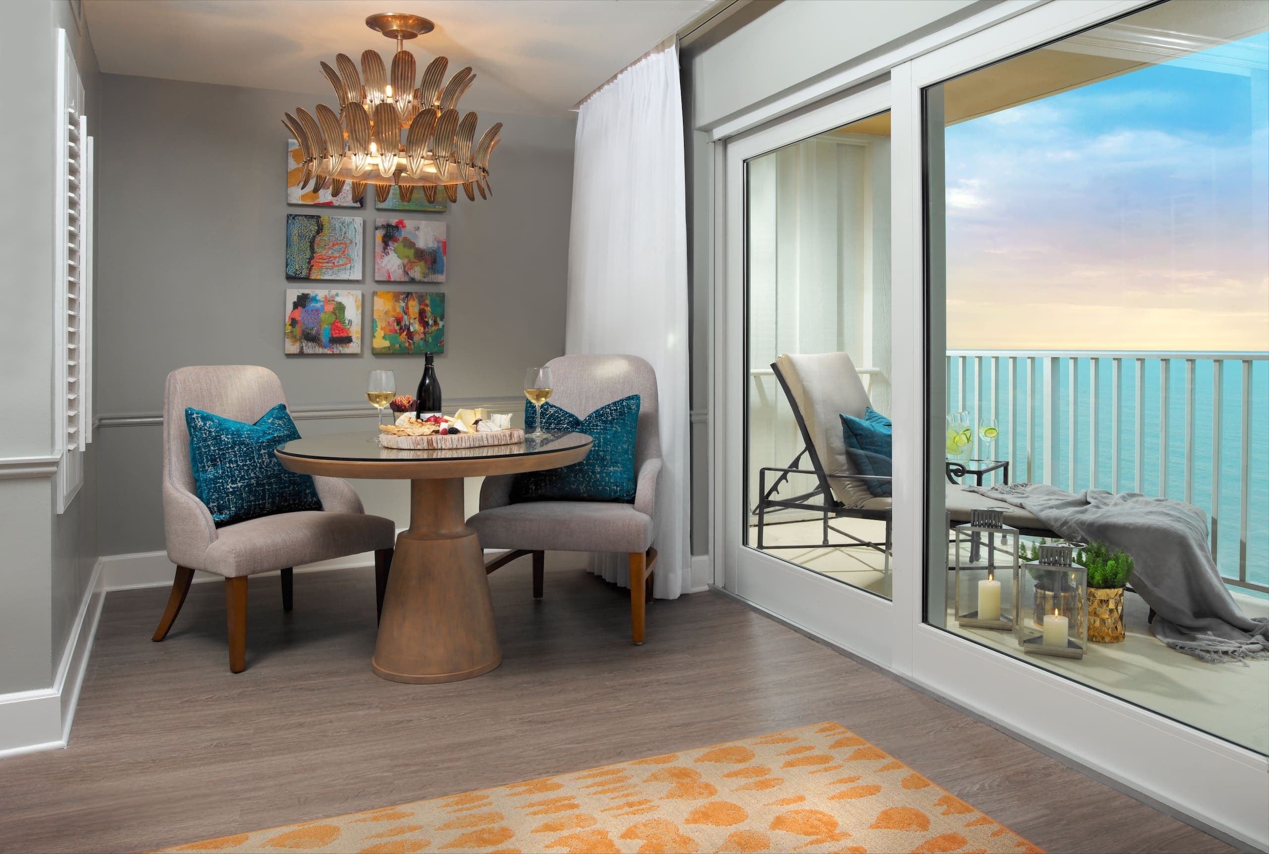 The dining area with a view of the water in a Laplaya Gulf Tower King Suite