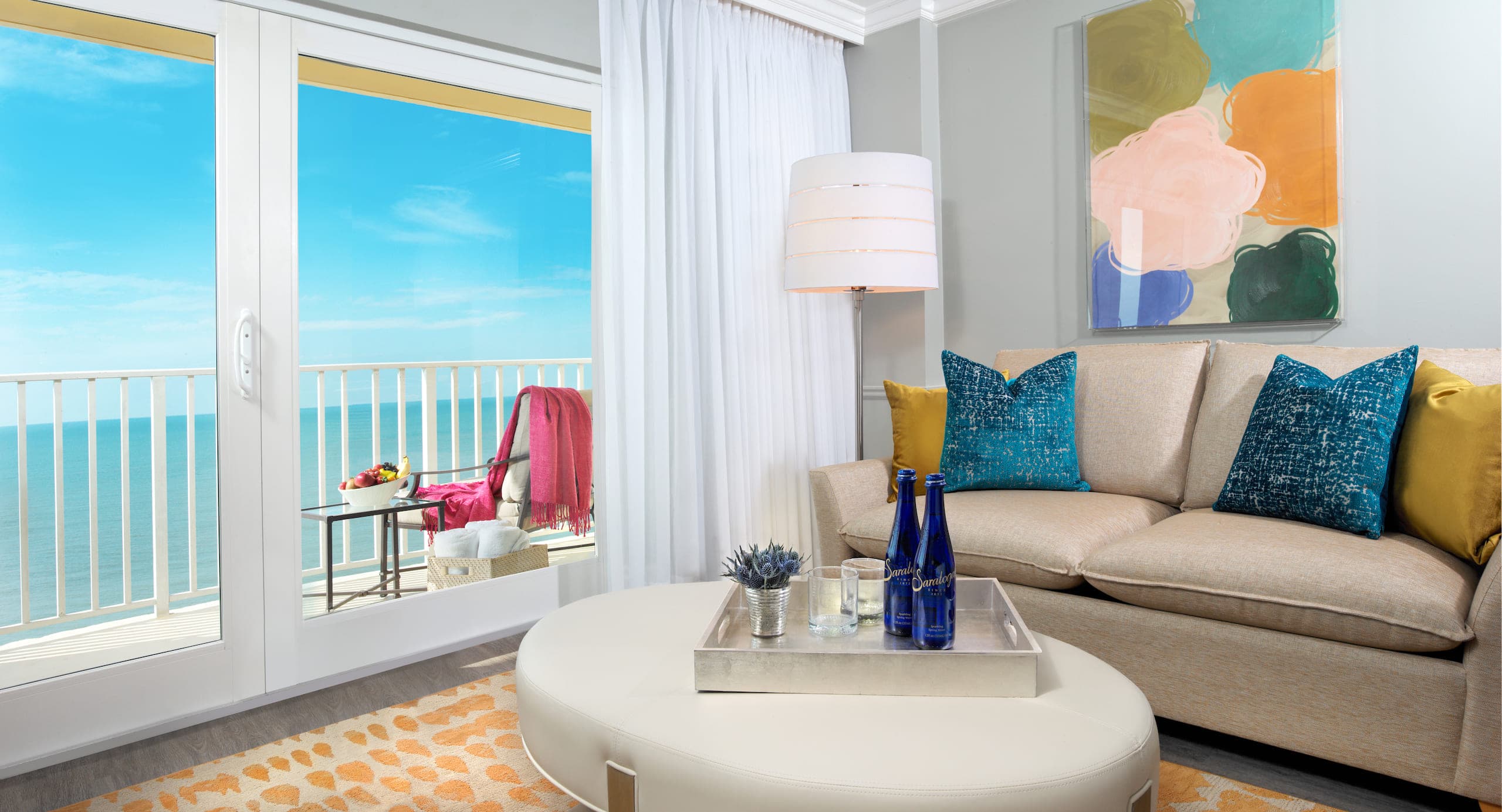 The living space and view of the water in a Laplaya Gulf Tower King Suite
