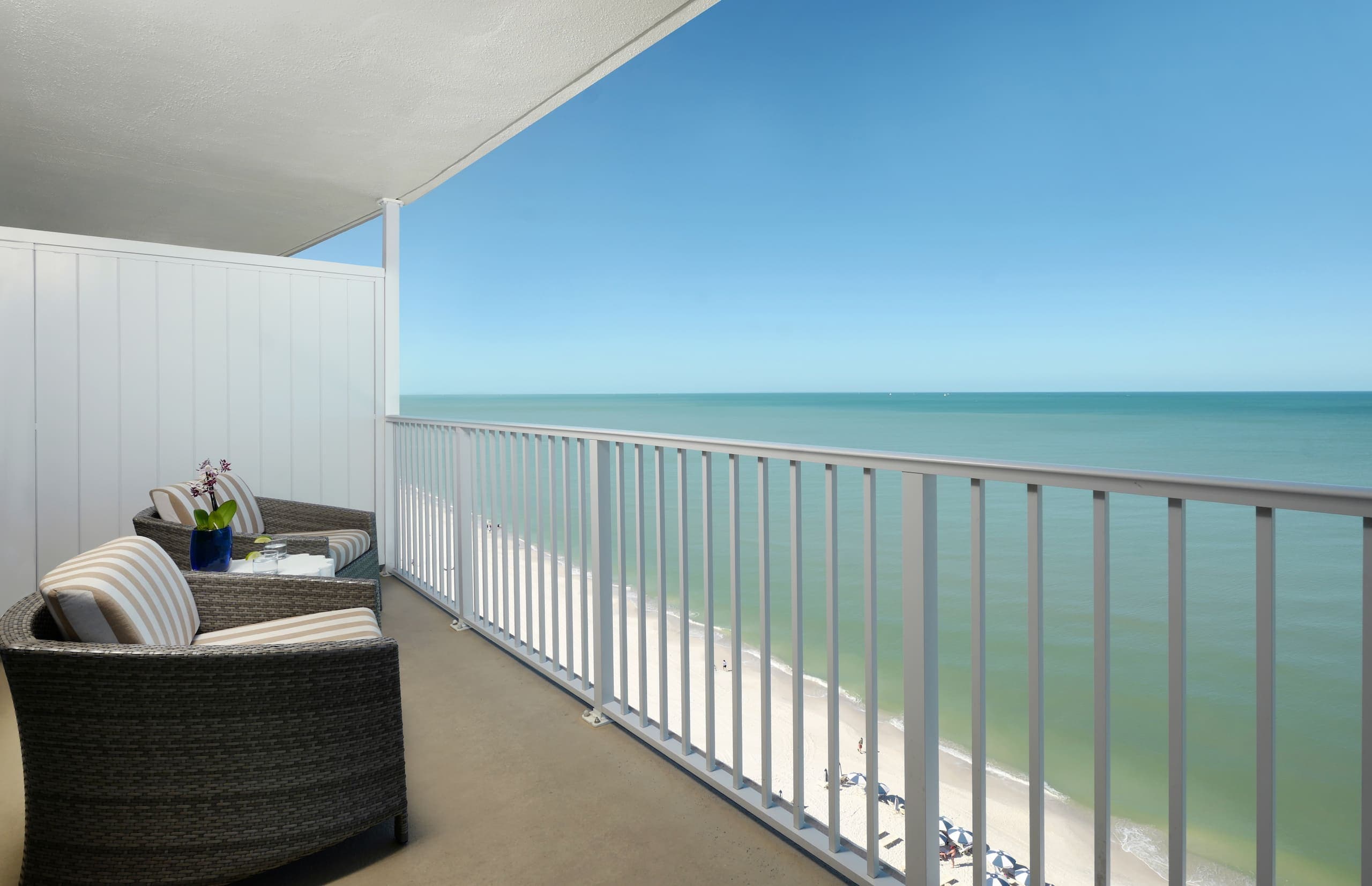 A balcony overlooking the water in a Gulf Tower Suite at LaPlaya