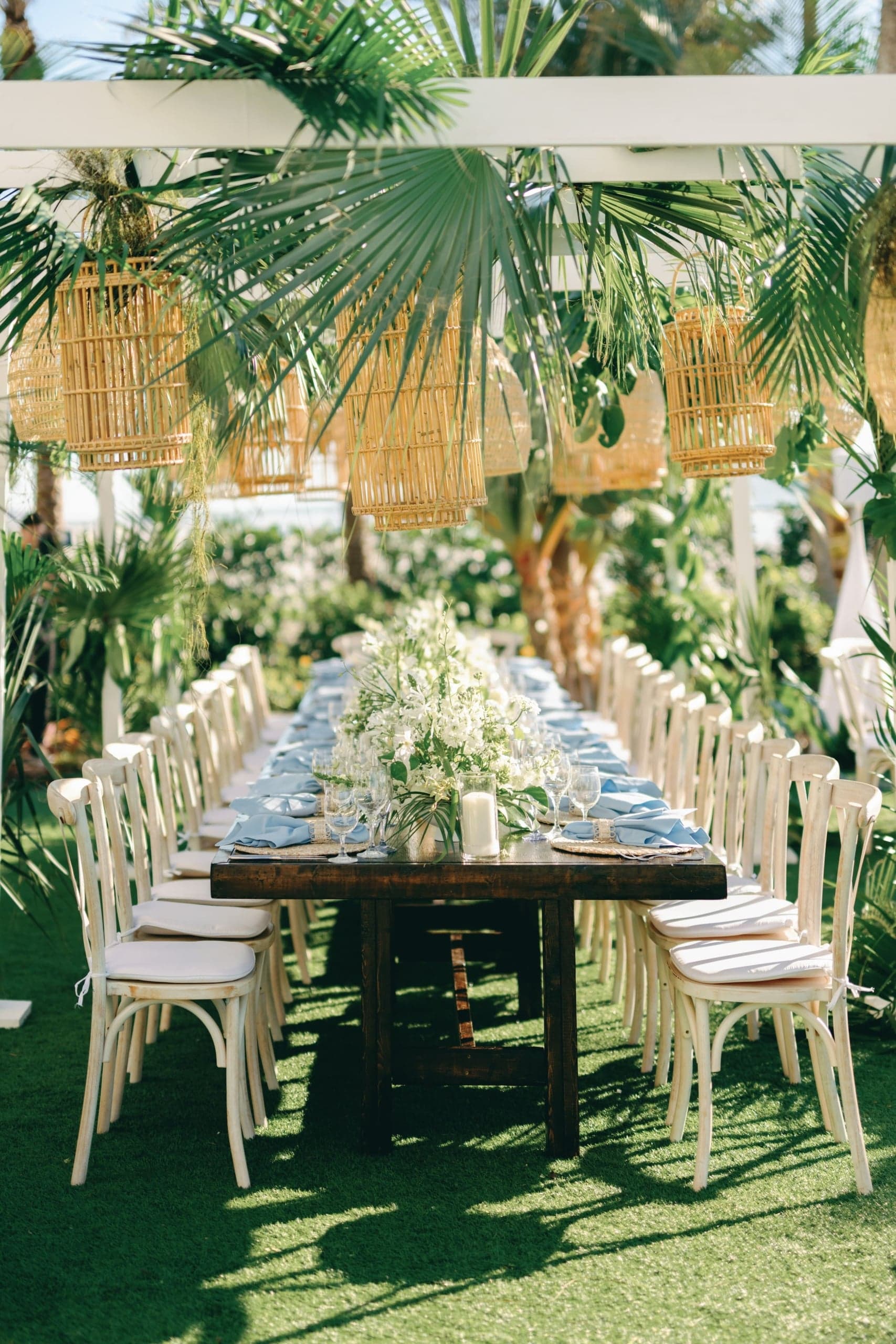 A table decorated and set up outside for a event dinner at LaPlaya