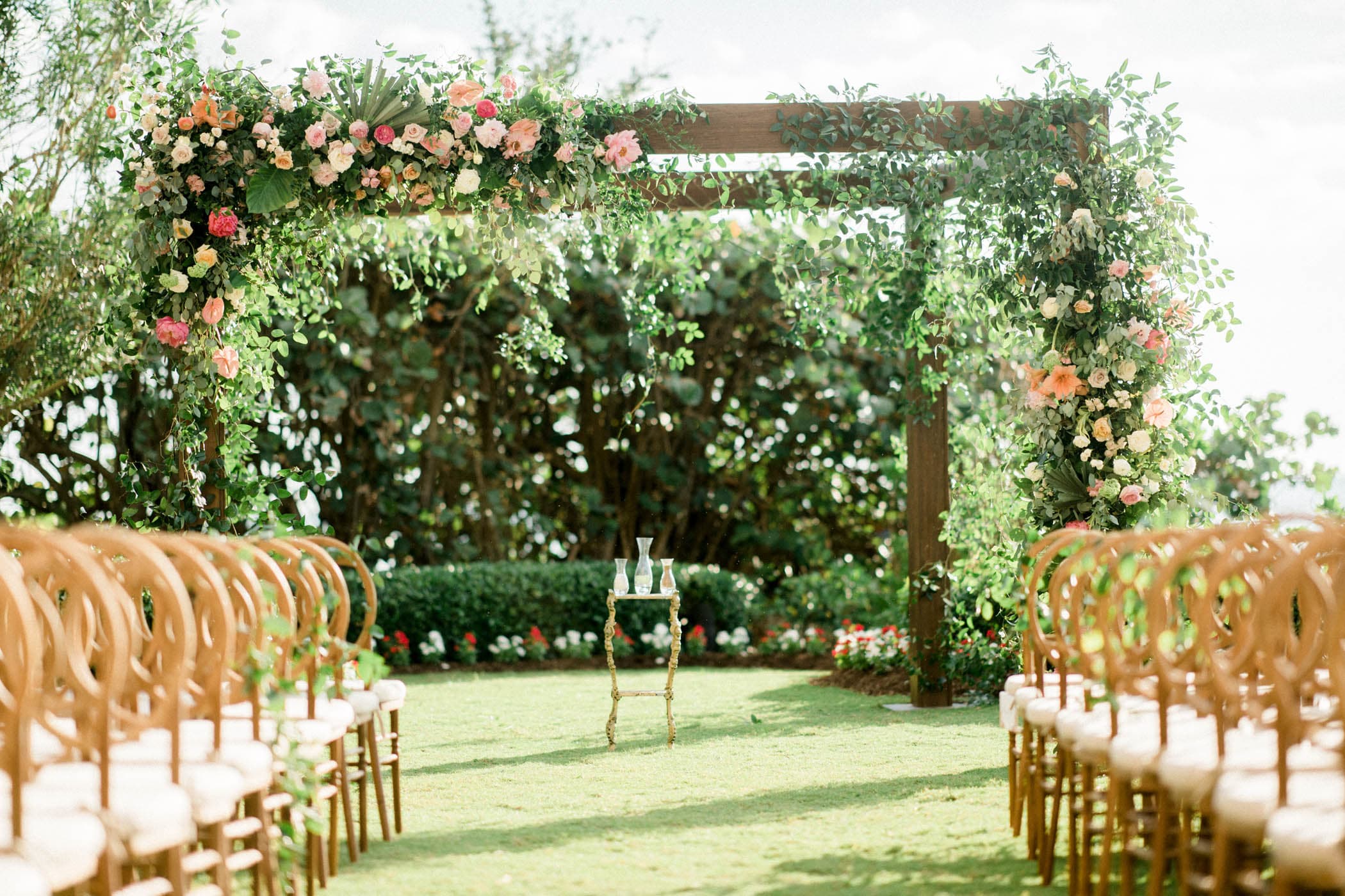 A wedding ceremony setup with rows of chairs on the lawn at LaPlaya