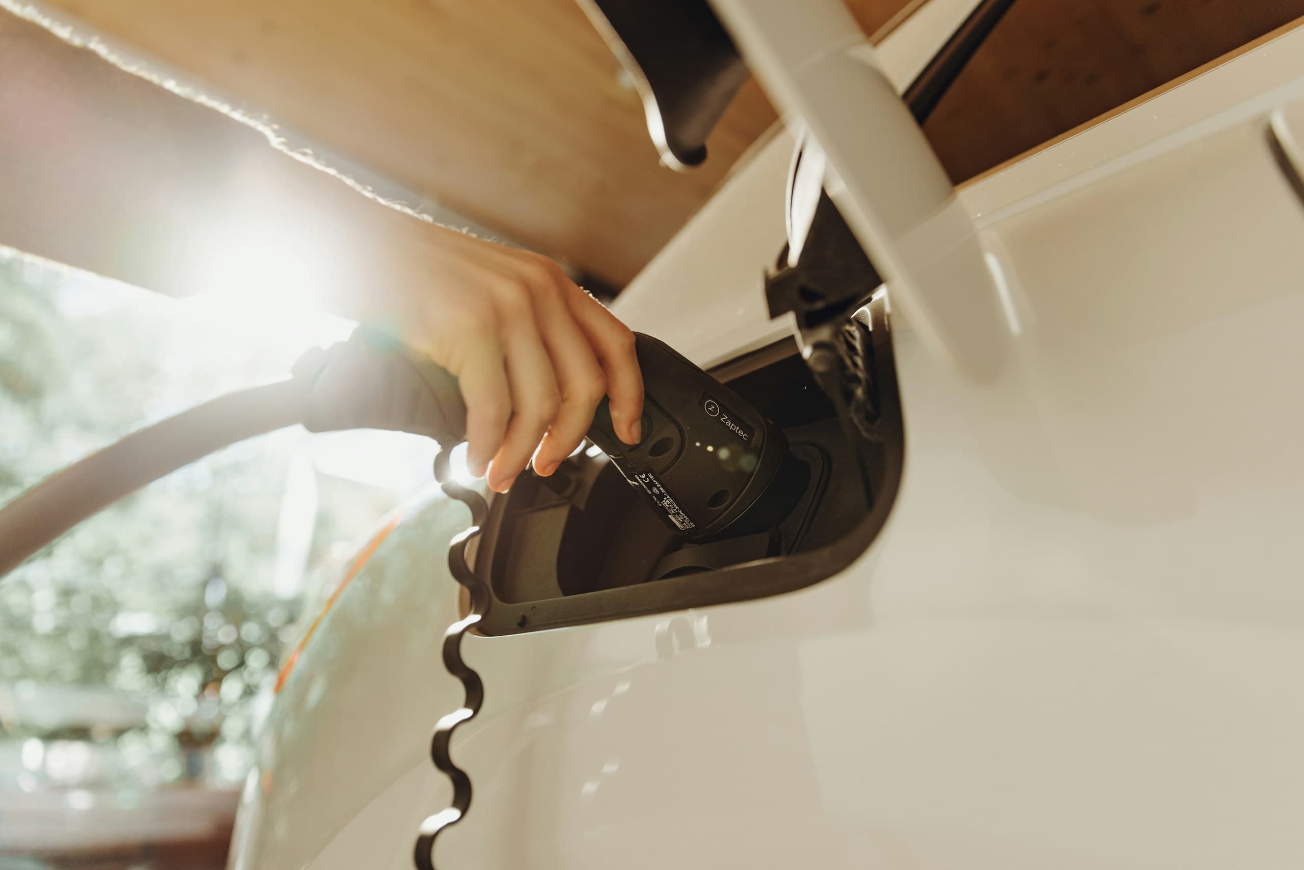 A person plugging into the AV charging station