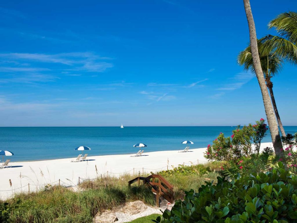 Naples, Florida Beach with chairs and umbrellas