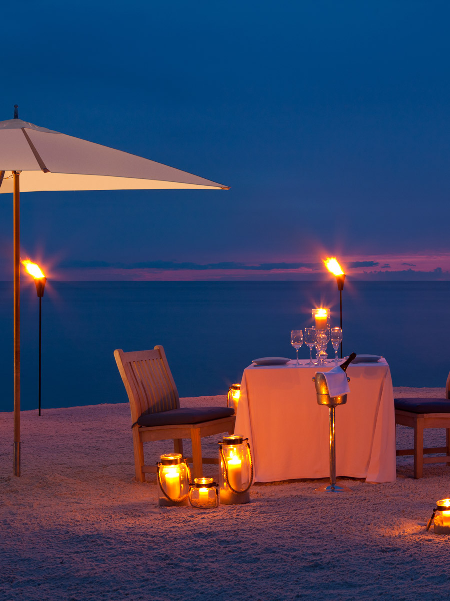 tables in the sand at Baleen restaurant at the Laplaya resort