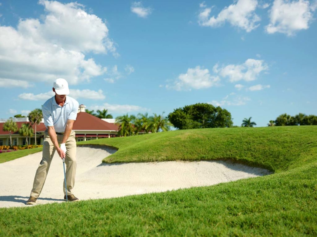 Golfer in sand trap at Naples Florida Golf Resort