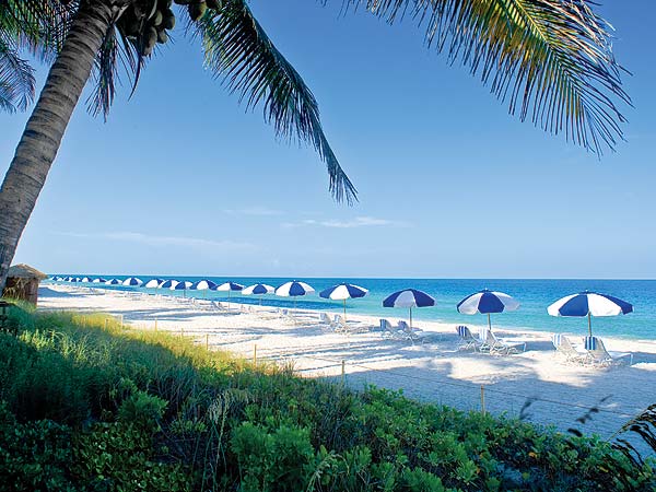 La Playa Beach and Golf Resort Beach with lounge chairs and umbrellas