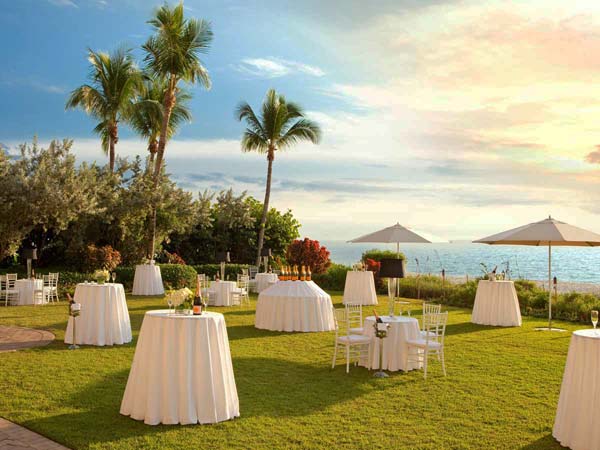 Beach wedding with lawn reception in Naples, FL