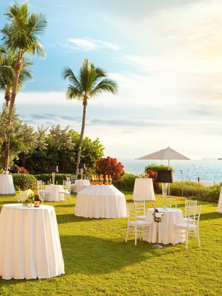 Beach wedding with lawn reception in Naples, FL
