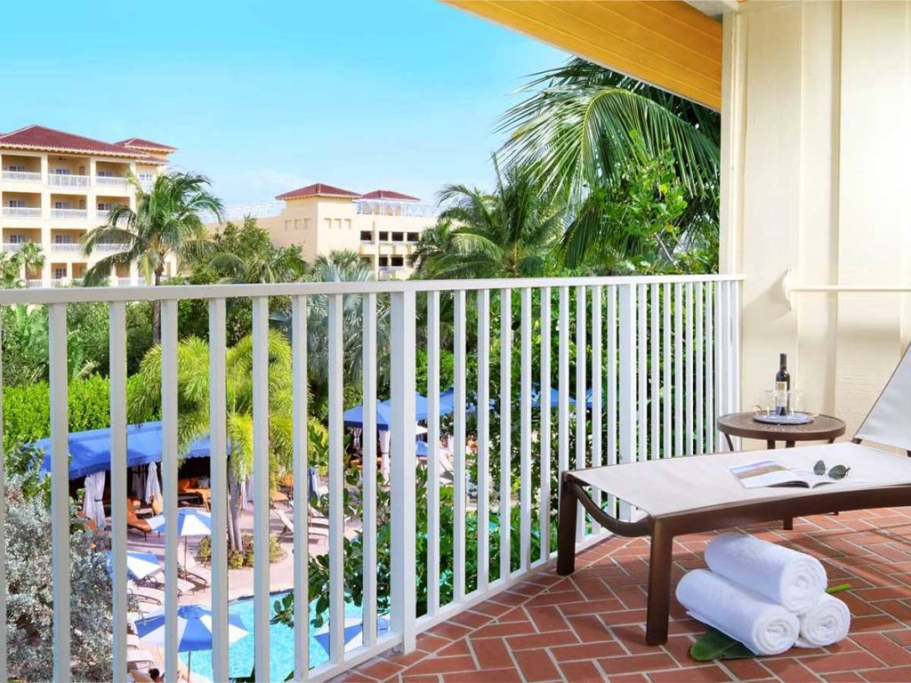 Room with pool view from balcony in Naples, FL